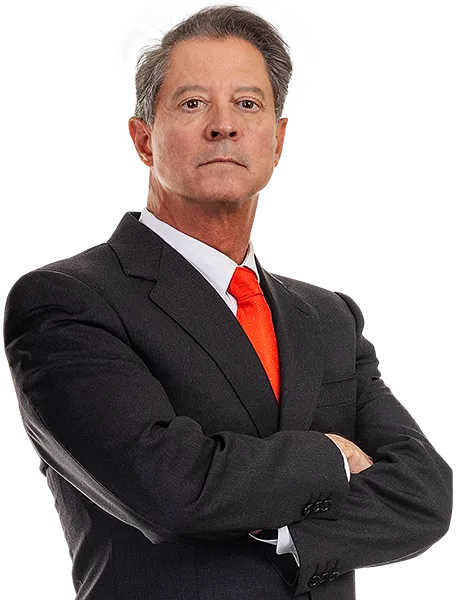 Personal Injury Attorney Tom McCutcheon Wearing A Dark Gray Suit With Red Tie Cropped At The Hip