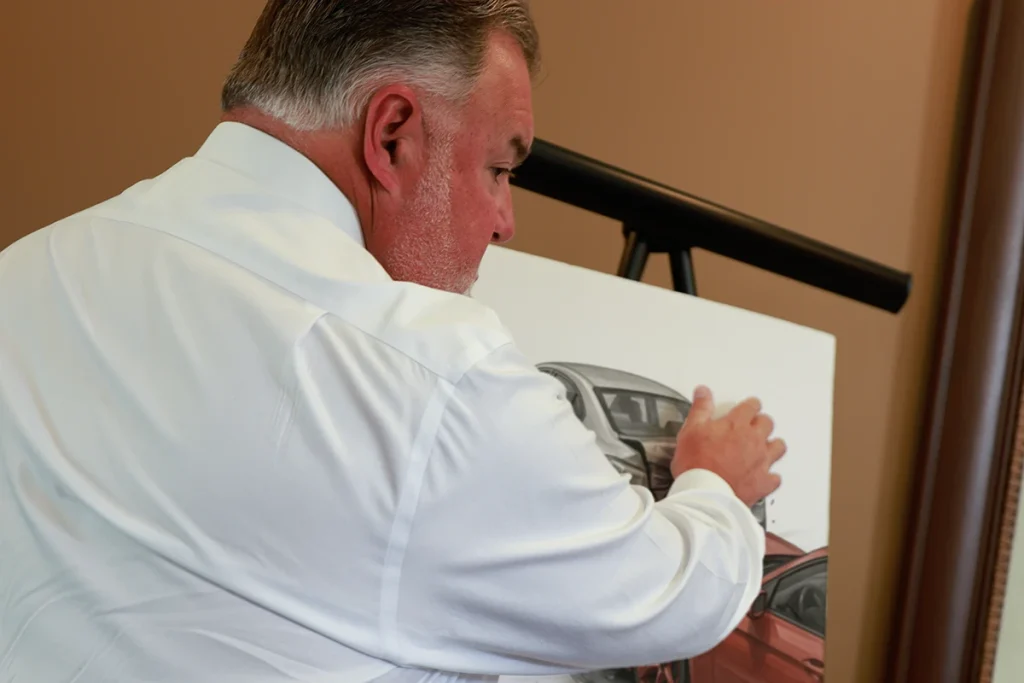 Attorney joel hamner explains a speeding accident exhibit to a client, presenting radar gun readings.