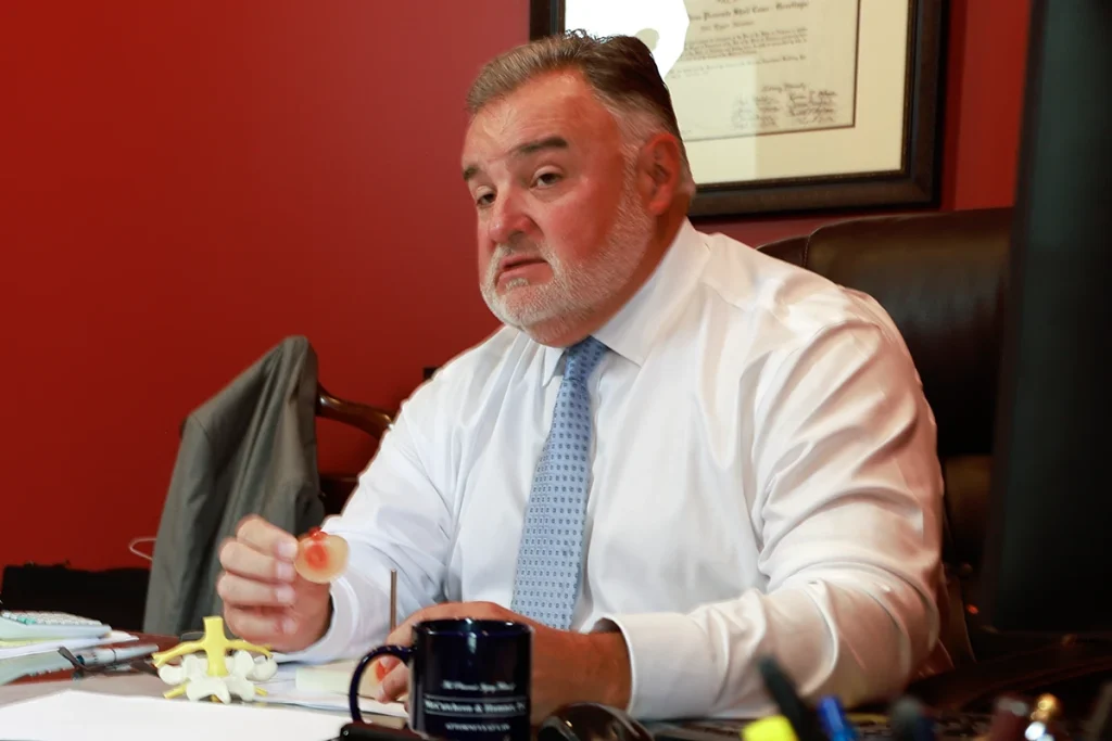 Attorney joel hamner meets with a client to discuss a toxic exposure exhibit mapping contamination sites.