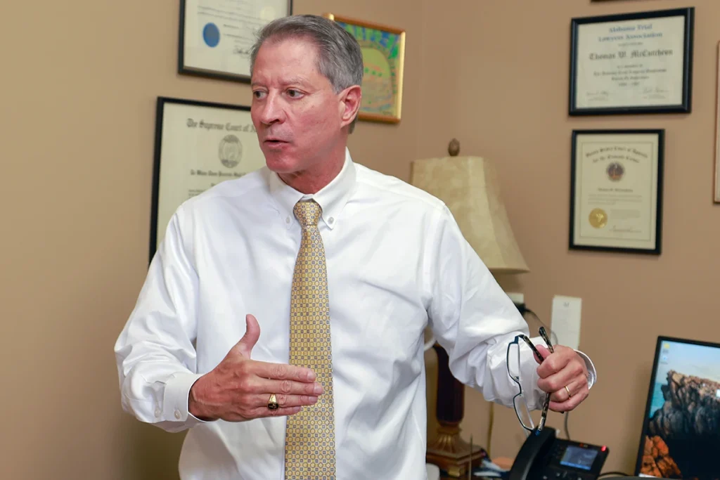 Attorneys joel hamner and tom mccutcheon consult with a client about a food delivery accident case.