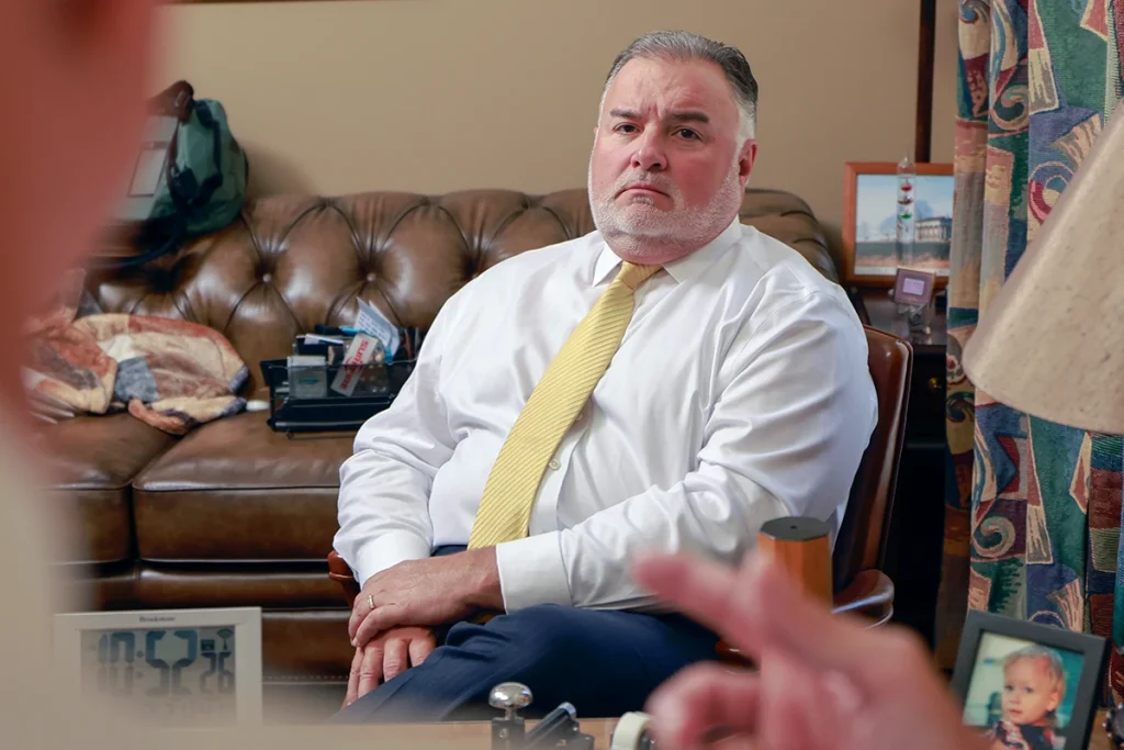 Attorneys joel hamner and tom mccutcheon consult with a client about a motorcycle passenger injury case.