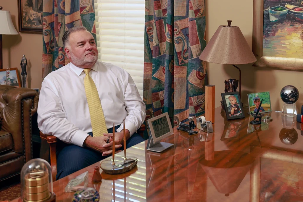 Attorneys joel hamner and tom mccutcheon consult with a client about a reckless driving accident lawsuit.