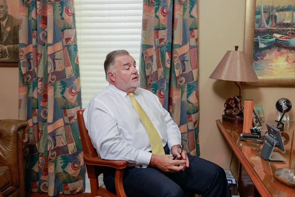 Attorneys joel hamner and tom mccutcheon meet with a client in tom’s office to discuss an atv and utv accident claim.