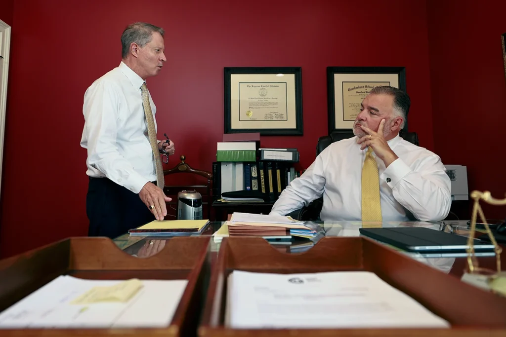 Attorneys joel hamner and tom mccutcheon plan a complex lawsuit after a highway tractor trailer collision.