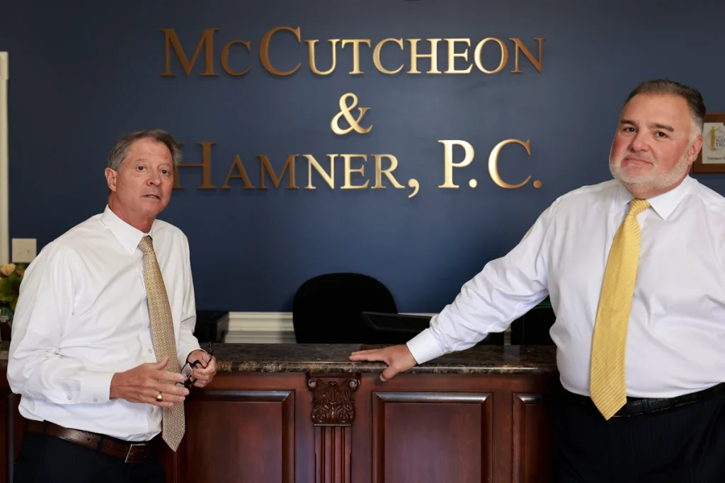Attorneys joel hamner and tom mccutcheon plan compensation strategies for a severe joint or ligament injury.