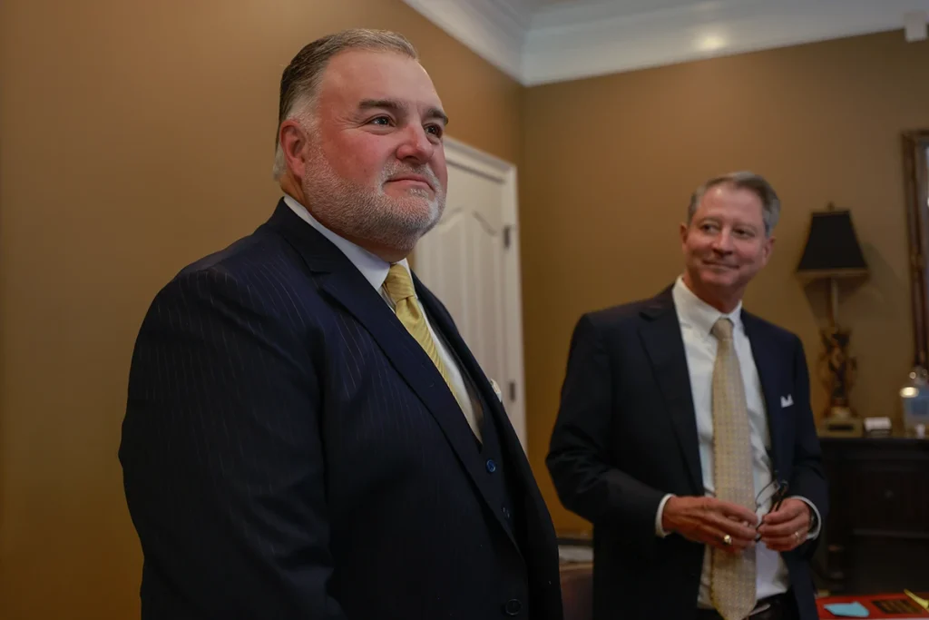 Joel hamner and tom mccutcheon discuss a dangerous work site injury caused by unsafe construction practices.