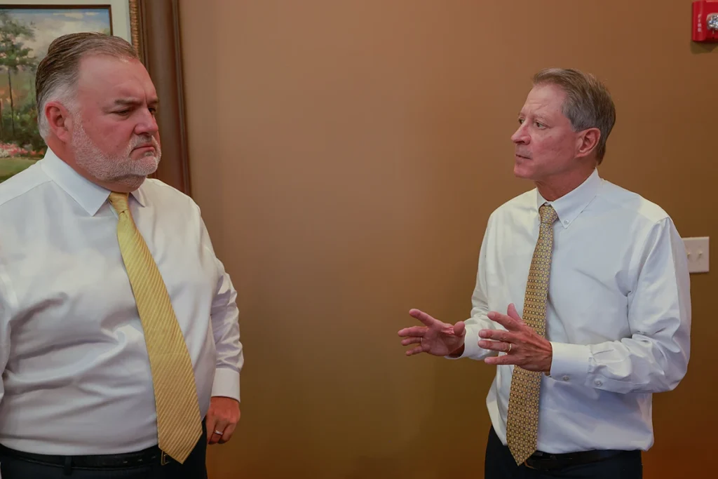 Joel hamner and tom mccutcheon review surveillance footage for a hit and run injury case.