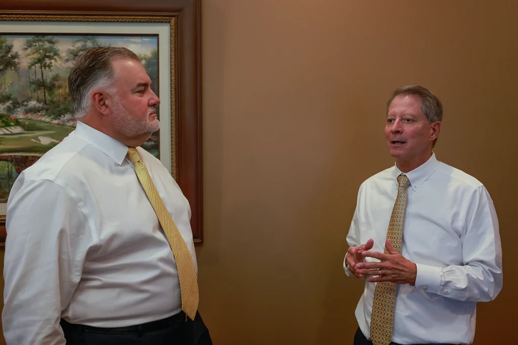 Joel hamner and lawyer tom mccutcheon strategize on a severe two vehicle impact case.
