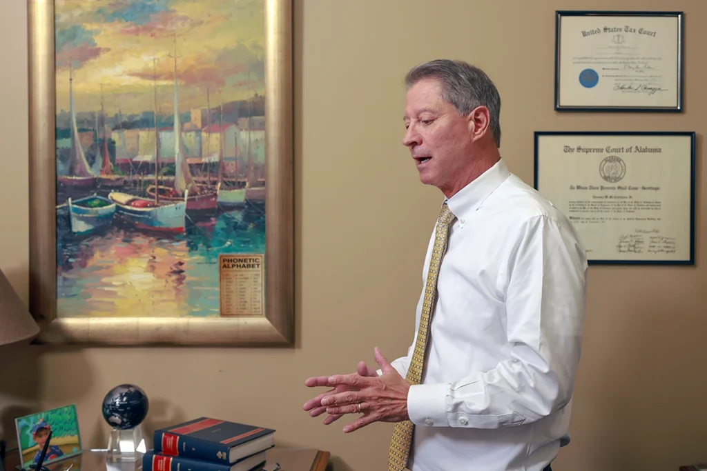 Joel hamner joins tom mccutcheon to discuss a public transportation accident case with a client.