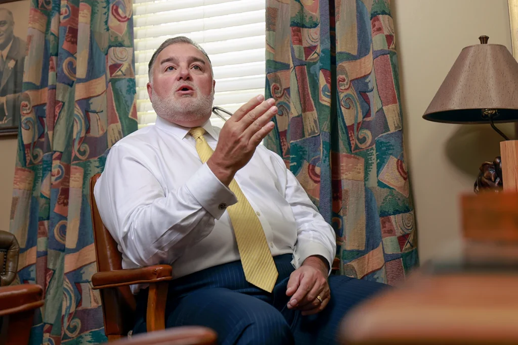 Joel hamner joins tom mccutcheon to discuss a scooter accident claim with a client.