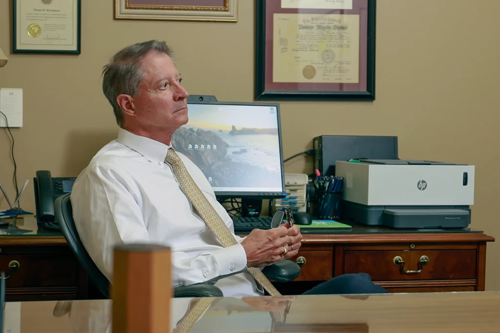 Joel hamner joins tom mccutcheon to discuss a tractor accident claim with a client.