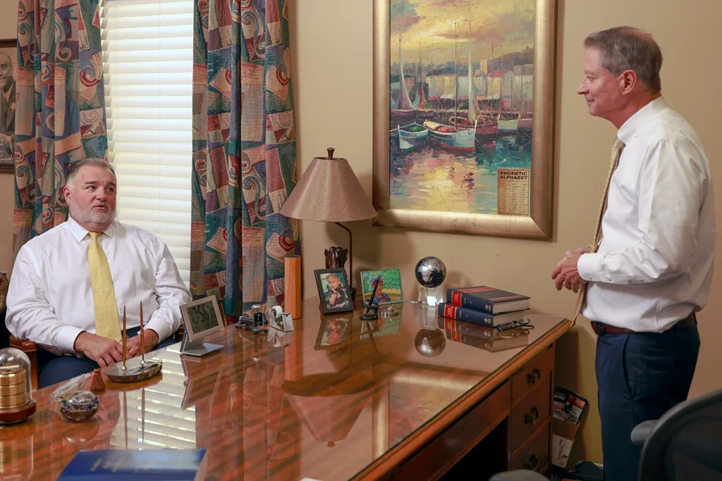 Joel hamner joins tom mccutcheon to evaluate a rollover accident case with a client.