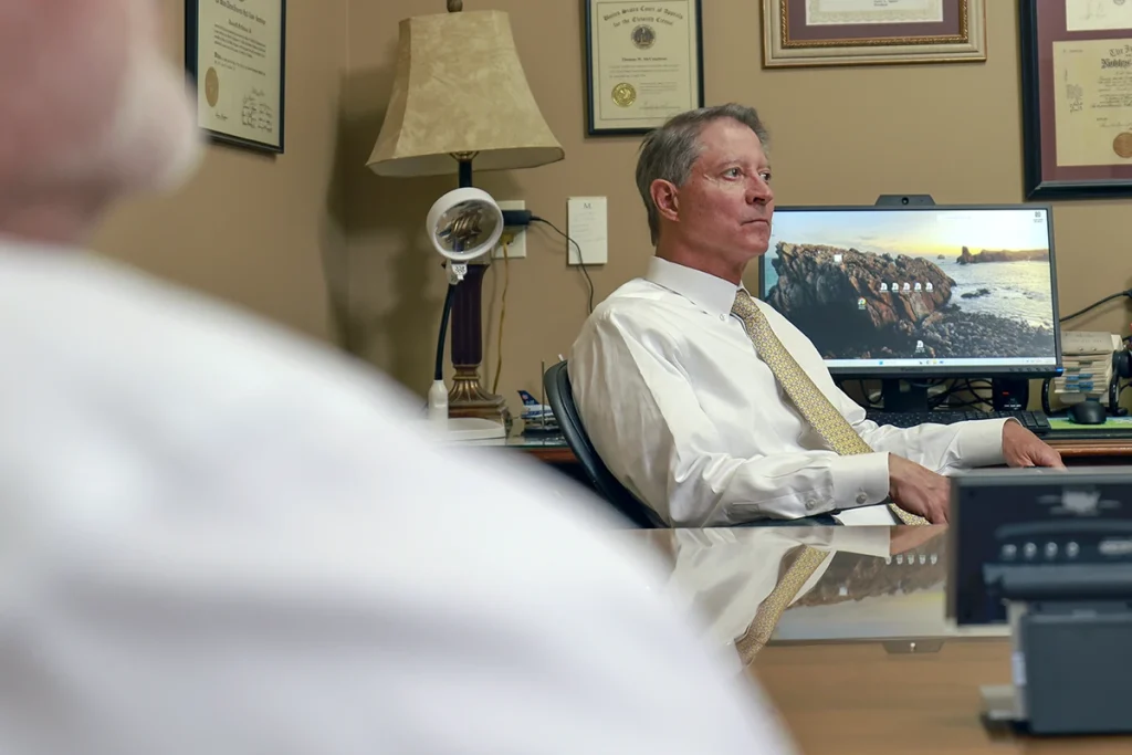 Joel hamner joins tom mccutcheon to talk with a client about a swimming pool accident claim.