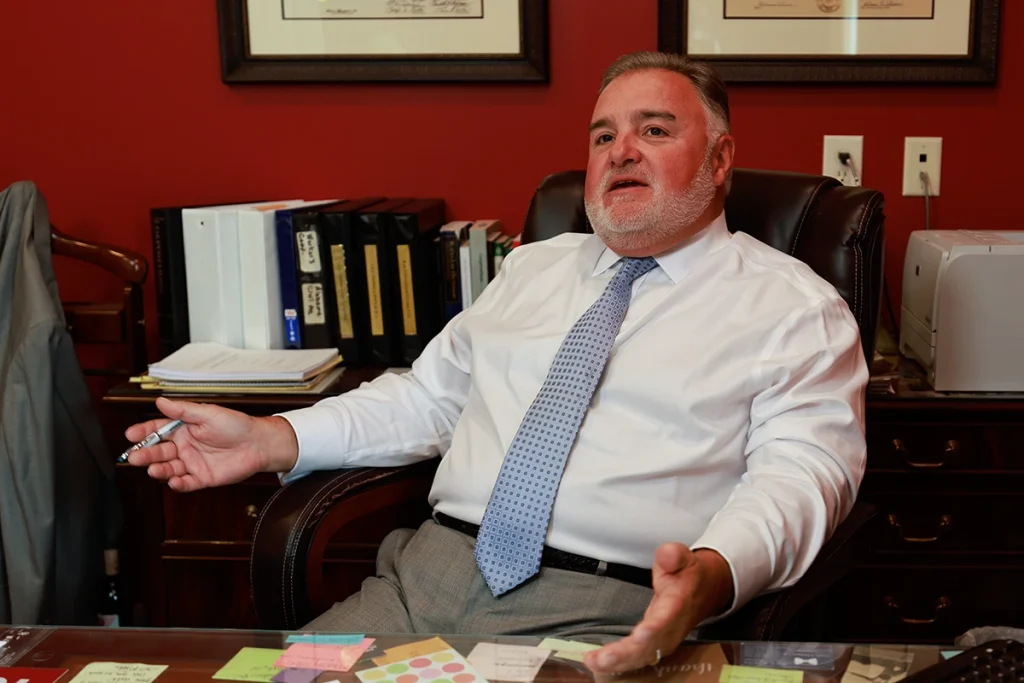 Lawyer joel hamner meets with a client to review an exhibit detailing an atv and utv accident investigation.