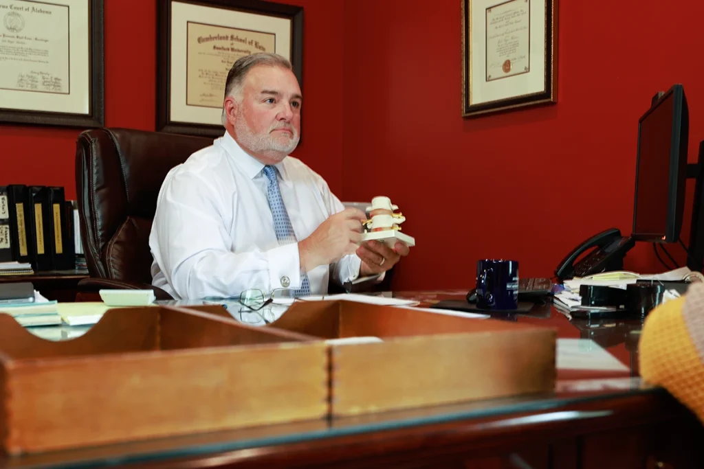 Lawyer joel hamner presents a boat and jet ski accident exhibit to a client, covering water safety details.