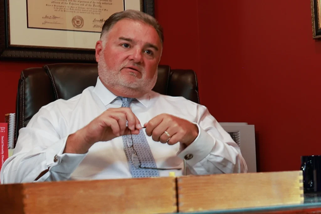 Lawyer joel hamner presents a side impact collision exhibit to a client, highlighting door intrusion evidence.