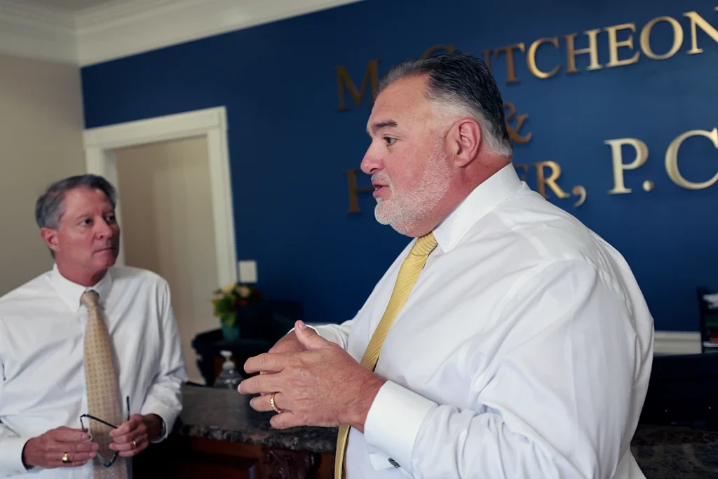 Lawyers tom mccutcheon and joel hamner investigate environmental reports for a water pollution injury case.