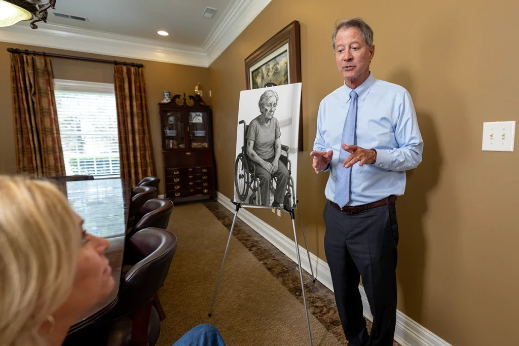 Personal injury attorney tom mccutcheon discusses a nursing home neglect or abuse claim with a client.