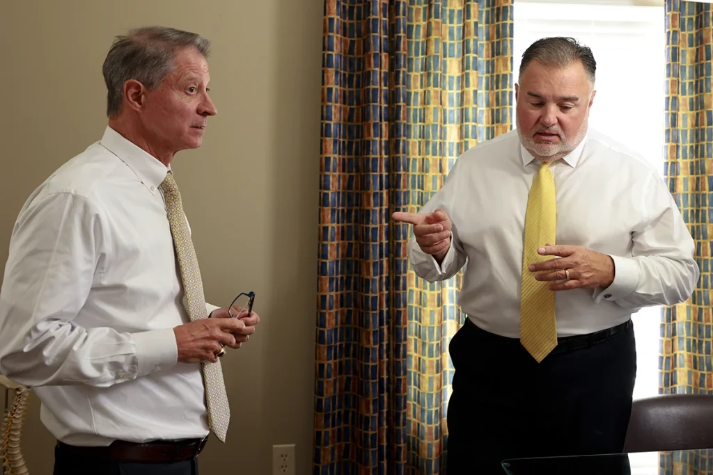 Tom mccutcheon and joel hamner evaluate a courier truck crash involving a dhl driver.