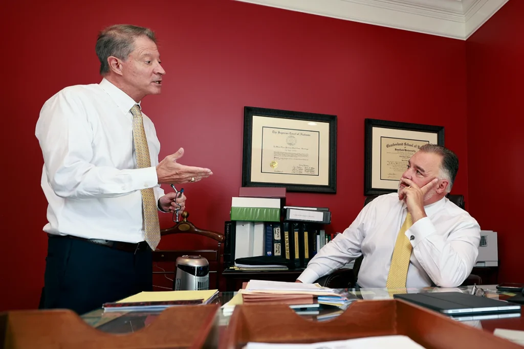 Tom mccutcheon and joel hamner evaluate neurological reports to build a traumatic brain injury claim.