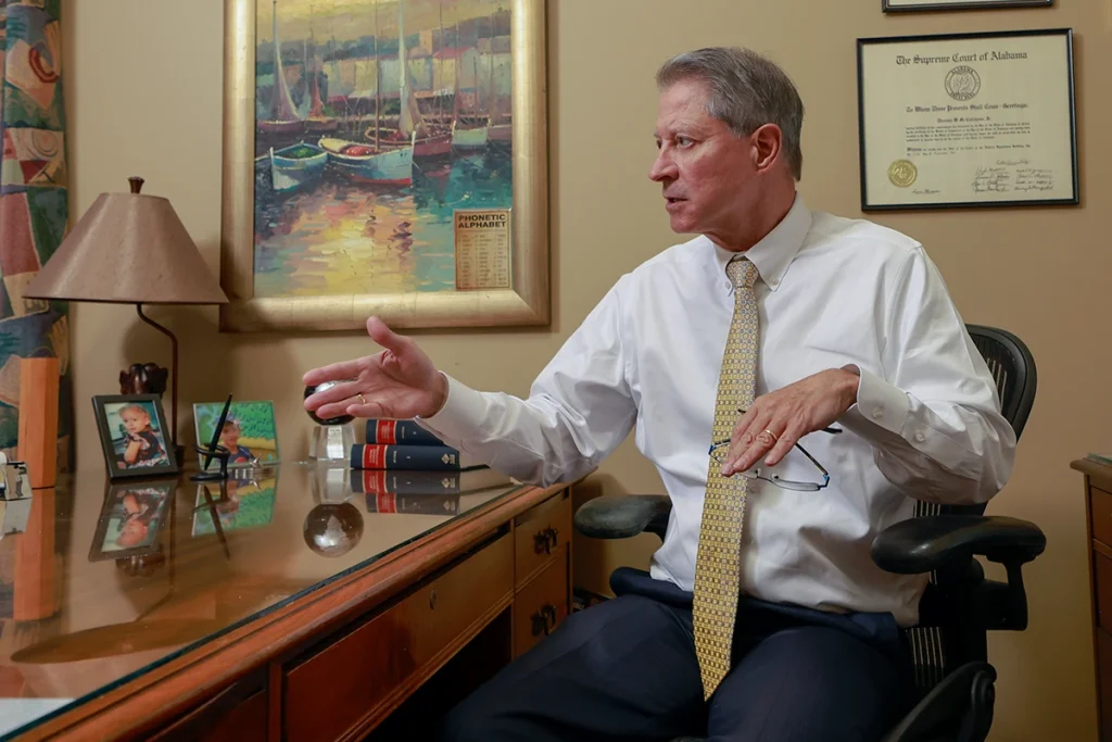 Tom mccutcheon and joel hamner meet with a client to review a premises liability injury case.