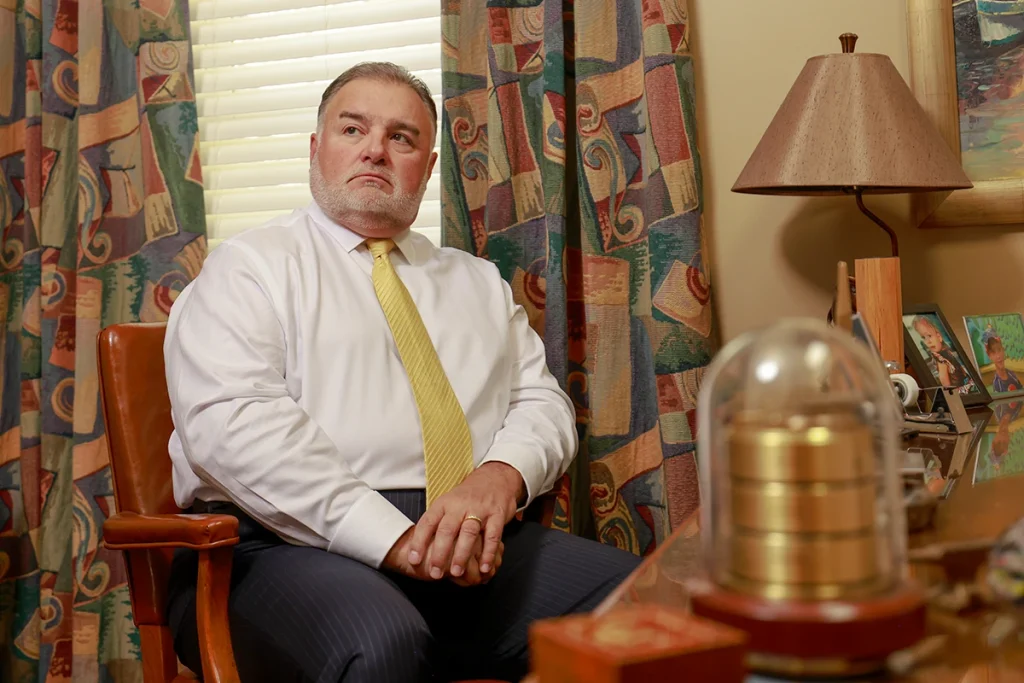 Tom mccutcheon and joel hamner meet with a client to review a skateboard accident claim.