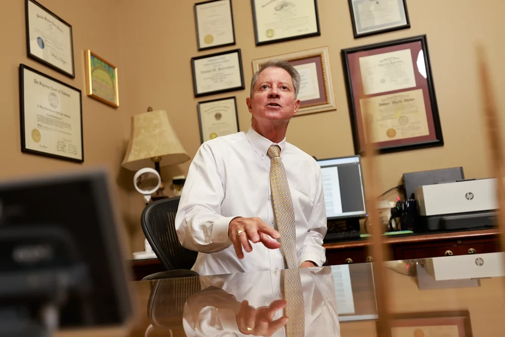 Tom mccutcheon and joel hamner strategize over a city bus or rail collision case.